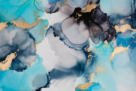 Abstract fluid art. Alcohol ink on canvas. Blue, black and gold.