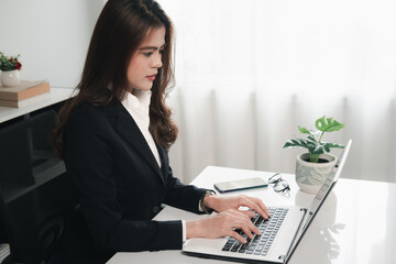 Women use laptop working in office workplace