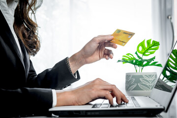 Women use credit card for online payment or internet transaction