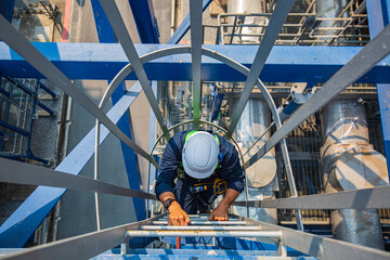 Male climb the stairway storage visual inspection tank