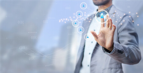 businessman touching person on gear icon with network for business moving by people , online business and partners concept