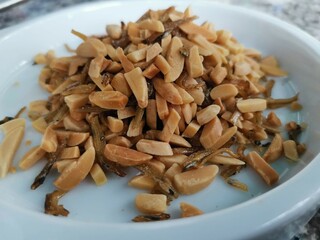 Dried fish and almond crumbs