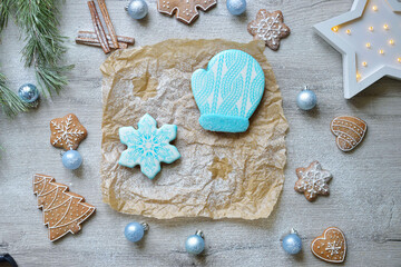 set of New Year's gingerbread cookies in blue glaze on a table with New Year's decor. christmas baking concept.