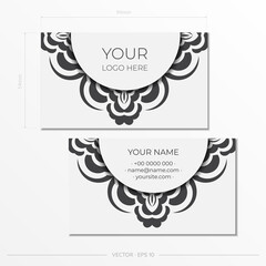 Business cards in white with gorgeous vector patterns of mandala ornaments. Business card design with monogram patterns.