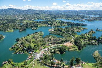 Fototapeta na wymiar Amazing panoramic view of the hydroelectric reservoir and lakes of El Peñol de Guatape, in Medellin, Colombia.