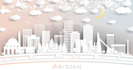 Abidjan Ivory Coast City Skyline in Paper Cut Style with White Buildings, Moon and Neon Garland.