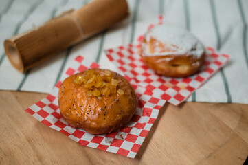 homemade flavored doughnuts on wooden board