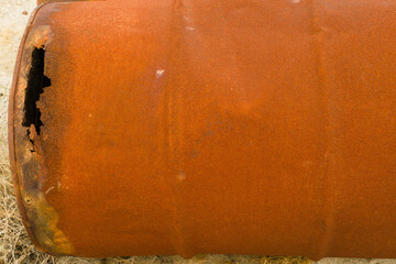 Old worn dented metal barrel, full of rusty coloir as an abstract idea.  coming from the earht and welded into useful element.