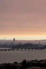 Fototapeta na wymiar San Francisco sunset in a Fog + smoky day.