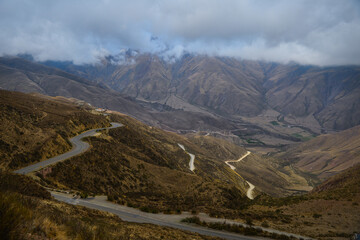 A view of the winding Cuesta del Obispo road up the cloud-shrouded Andes, Salta Province, northwest...