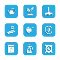 Set Wheelbarrow with dirt, Garden sprayer for fertilizer, Pack full of seeds of plant, Shield leaf, Hand holding flower, rake and Watering can icon. Vector