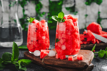 Watermelon drink. Fresh watermelon cuts with ice and mint in glass.