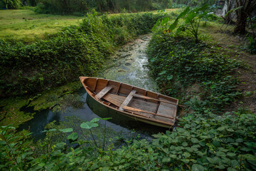 Wooden rowboat on the banks of the river