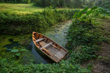 Wooden rowboat on the banks of the river