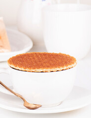 cup of coffee and waffles on a plate