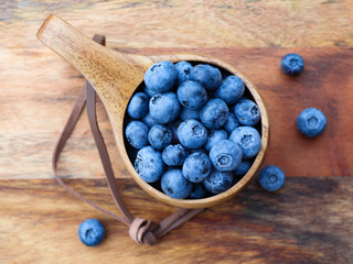 Blueberries in a wooden bowl