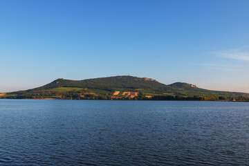 View of Lake Musov and Palava in the Czech Republic. In the background a television transmitter and the ruins of the castle Devicky.
