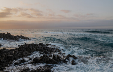 Landscape of rock formation in Barronal beach in Cabo de Gata nature park, Spain, during sunrise