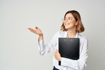 Business woman in white shirt with documents in hands emotion work success