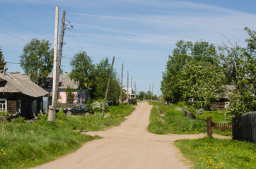 Fototapeta na wymiar Dirt road in a Russian village. Wide road. 