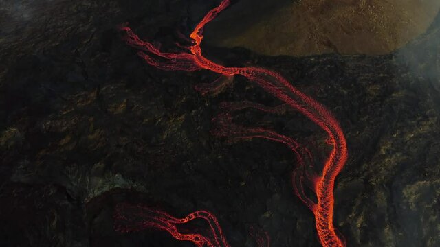 Incredible aerial of the dramatic volcanic eruption of the Fagradalsfjall (Geldingadalur) volcano in Reykjanes peninsula Iceland. Flowing lava. Close look. Drone footage.
