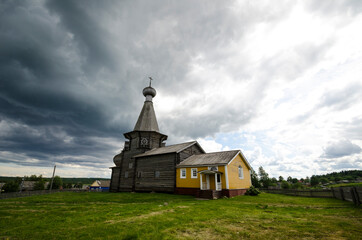 Nikolsky temple in the village of Nyonoksa against the backdrop of a stormy sky. Russia, Arkhangelsk region 