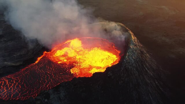 Close look on volcano. Incredible aerial of the dramatic volcanic eruption of the Fagradalsfjall (Geldingadalur) volcano in Reykjanes peninsula Iceland. Flowing lava. Drone footage.