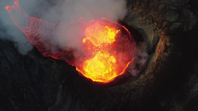 Close look on volcano. Incredible aerial of the dramatic volcanic eruption of the Fagradalsfjall (Geldingadalur) volcano in Reykjanes peninsula Iceland. Flowing lava. Drone footage.
