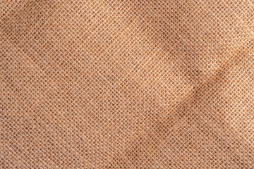 Texture of old sackcloth burlap with a fold