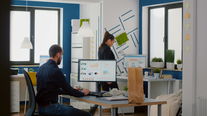 Businesswoman holding takeaway fastfood order package during takeout lunchtime in business office working at company strategy. Delivery guy bringing tasty lunch food delivery service at workplace