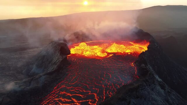 Close look on volcano. Incredible aerial of the dramatic volcanic eruption of the Fagradalsfjall (Geldingadalur) volcano in Reykjanes peninsula Iceland. Flowing lava. Drone footage.
