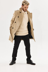 man in coat fashion posing full length isolated background