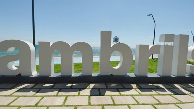 Cambrils beach in Barcelona Catalonia Spain poster white letters anchor view of the turquoise blue sea