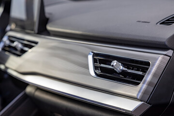 Obraz na płótnie Canvas interior air duct on the front panel of a premium car