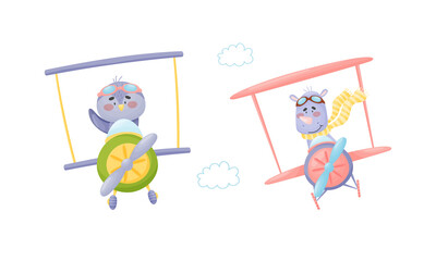 Cute baby animals pilots set. Funny bird and rhino pilot characters flying by airplane cartoon vector illustration © Happypictures