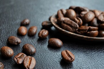 coffee beans on wooden spoon