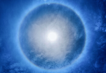 solar halo , solar halo , Thte ring of rainbow around the sun a rainbow crown on blue sky background.