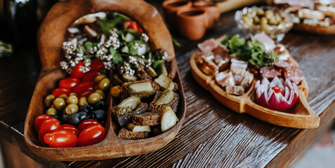 Beautifully decorated snacks on the banquet table before the holiday. Catering food and drink on wedding party