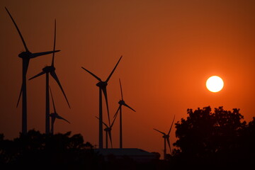 wind turbines at sunset