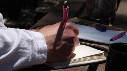  Man Write, A man take a note in his notebook at night, write note, slow motion - Powered by Adobe