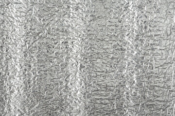 Seamless background texture of silver foil. shiny white surface. reflector