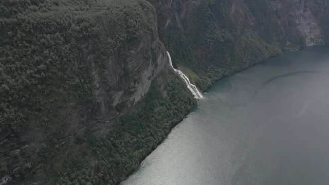 Aerial point of interest shot around the Suitor waterfall in Geiranger fjord, Norway