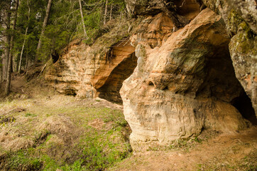 Beautiful Gudzona cave in spring day, Mazsalaca, Latvia.