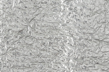 Seamless background texture of silver foil. shiny white surface. reflector