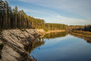 Steep bank of the river Gauja on a sunny spring evening, Latvia.
