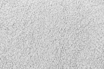 White curly wool seamless texture background. texture with short factory material.