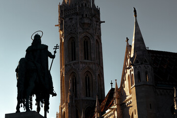 Naklejka na ściany i meble Silhouette of Statue of Stephen I of Hungary and Matthias Church at Fisherman's Bastion. Budapest, Hungary