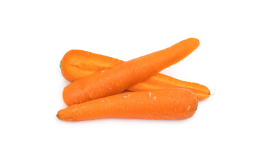 A pile of whole and sliced carrot on isolated white background