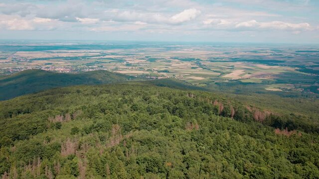 Drone flight over mountain village with forests. Sleza mountain near Wroclaw in Poland. Nature background, aerial view