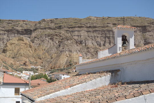 Bell tower in a little church of a village mediterranean in the dessert